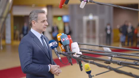 Greek-Prime-Minister-Kyriakos-Mitsotakis-talking-to-the-press-in-the-European-Council-building-during-EU-summit-in-Brussels,-Belgium