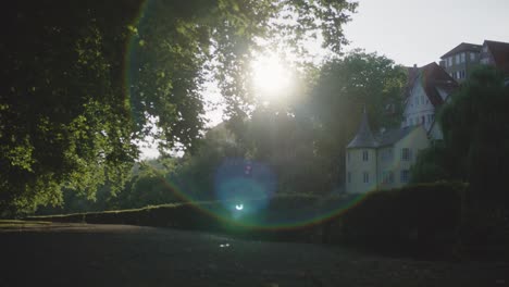 Sun-Flare-in-Park-in-Tubingen,-Germany-in-4K-Downtown-Home-of-Europes-Oldest-University-At-Sunset