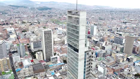 Droneshot-view-of-Bogota-city,-Bacatá-building-centered-in-the-shot