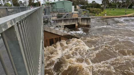 Yarrawonga,-Victoria,-Australia---7-November-2022:-Maelstrom-of-water-violently-entering-the-Murray-River-from-Lake-Mulwala-at-the-Yarrawonga-weir-bridge