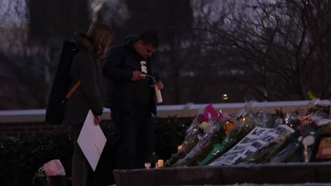 Michigan-State-University-Mass-shooting-memorial-at-The-Spartan-Statue-people-lighting-candles