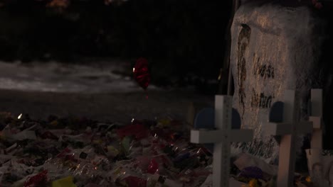 Michigan-State-University-Mass-shooting-memorial-at-the-Rock-with-markers-and-balloon