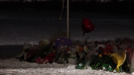 Michigan-State-University-Mass-shooting-memorial-at-the-Rock-with-red-balloon