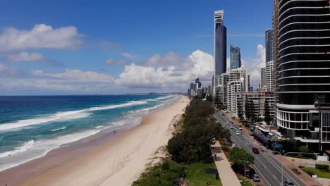 Premium stock video - Looking back at surfers paradise from water with drone