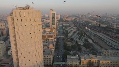 Aerial-View-Of-Habib-Bank-Plaza-In-Karachi-Bathed-In-Orange-Sunset-Light-Beside-Railway-Colony