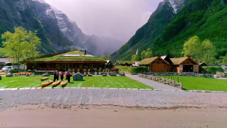 Pull-back-aerial-reveal-of-the-Viking-Valley-village-in-Gugvangen,-Norway
