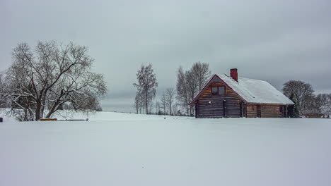 Time-lapse-of-a-wooden-house-in-a-snowy-landscape