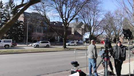 Media-along-Grand-River-Avenue-in-East-Lansing,-Michigan-the-day-after-the-mass-shooting-on-the-campus-of-Michigan-State-University-in-2023