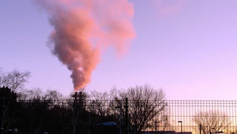 Polluting-emissions-released-from-a-factory-located-in-the-urban-area-during-sunset
