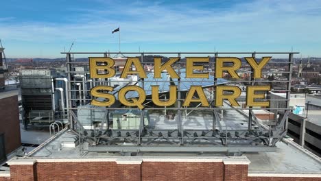 Aerial-rising-shot-of-Bakery-Square-sign