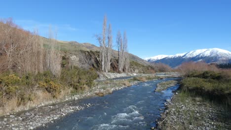 High-country-river-flows-steadily-on-a-clear,-calm-mid-winter's-day---Kowai-River,-Canterbury