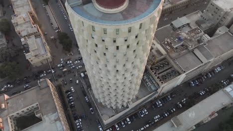 Aerial-Overhead-View-Of-Habib-Bank-Plaza-In-Karachi-Against-Orange-Sunset-Sky