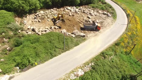 Excavator-removing-sand-into-dump-truck