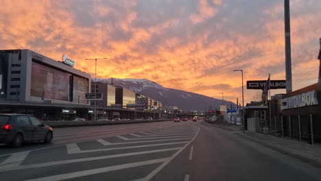 Driving-on-the-Sofia-south-ring-road-and-Cherni-Vrah-the-summit-of-Vitosha-Mountain-at-sunset