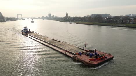 Aerial-Side-dolly-shot-of-The-ARNE-vessel-in-Dordrecht-Netherlands-during-golden-hour