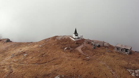Orbit-drone-video-orthodox-chapel-church-top-foggy-cloudy-mountain-Kaimaktsalan