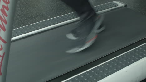 Close-Up-of-a-Man's-Feet-Running-on-a-Treadmill