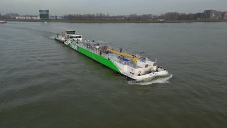 Aerial-Titan-LNG-ship-in-Dordrecht,-Netherlands,-running-between-ports