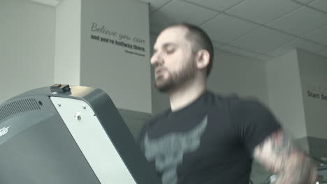 Close-Up-Low-Angle-of-a-Young-Man-Running-on-a-Treadmill