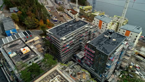 Waterside-buildings-in-Stockholm,-Sweden---aerial-tilt-up-reveal