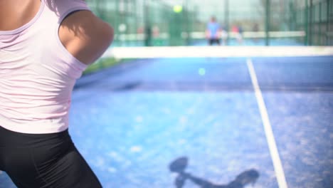 Murcia-Spain---February-21-2023:-Young-sportswoman-and-man-couple-playing-padel-tennis-in-slow-motion