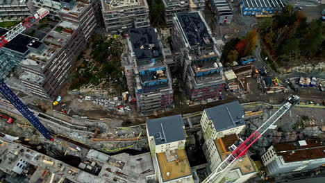 Aerial-top-down-shot-of-large-construction-site-with-new-real-estate-with-apartment-blocks
