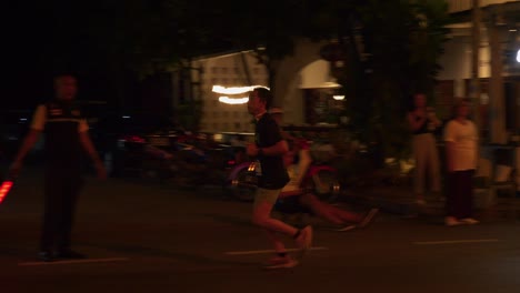 Solo-runner-during-the-night-running-contest-Samui-Run,-in-Koh-Samui-Island