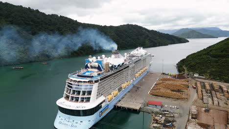 Ovation-Seas-cruise-ship-docked-at-Waimahara-log-Wharf,-Picton,-New-Zealand,-aerial-view