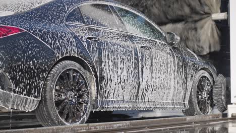 Luxury-car-in-the-wash-roller,-filled-with-foam