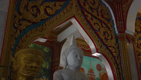 Marble-buddha-statue-at-Chalong-temple-Phuket-Thailand-tilt-shot
