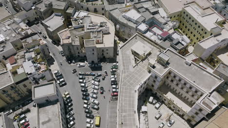 Aerial-footage-passing-over-the-steeple-of-the-Basilica-Cattedrale-Metropolitana-Primaziale-San-Sabino-in-Bari,-Italy