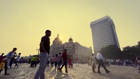 A-shot-of-people-going-by-their-way-in-Mumbai-near-the-Taj-hotel