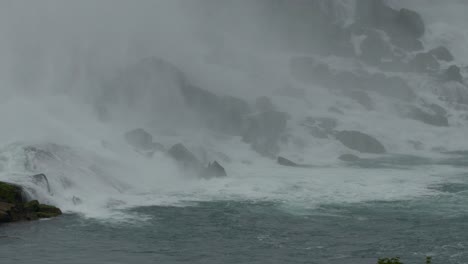 Massive-mist-from-huge-and-powerful-waterfall-on-rocky-coastline