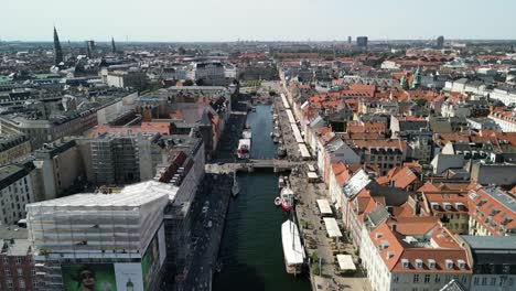 Nyhavn-Harbor-Aerial-Descent,-Copenhagen,-Denmark