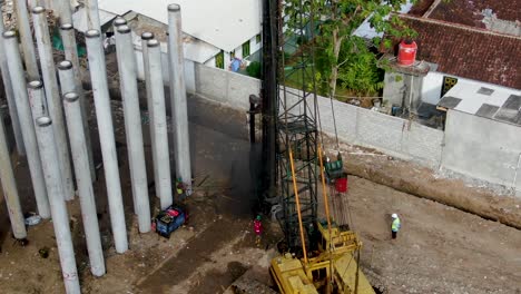 Machine-installing-bored-piles-for-monorail-foundations-on-Java-Indonesia-aerial