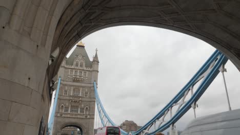 Walking-from-south-end-of-Tower-Bridge-in-London-on-a-cloudy-day