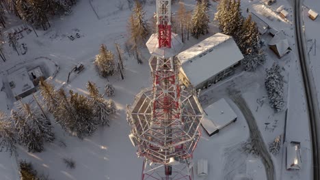 Cell-tower-in-snowy-landscape-at-Gubalówka,-Poland
