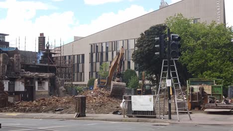 Slow-motion-of-a-bulldozer-clearing-the-rubble-of-an-old-pub