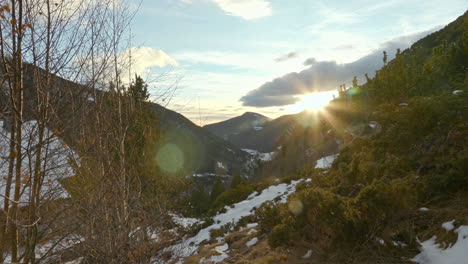 Timelapse-of-the-cloudy-sunset-in-Andorra,-the-sun-hides-behind-the-Pyrenees-mountains