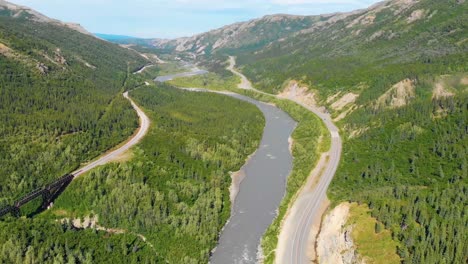 4K-Drone-Video-of-Chulitna-River,-Alaska-Railroad-and-Parks-Highway-Route-3-near-Denali-National-Park-and-Preserve,-Alaska-during-Summer