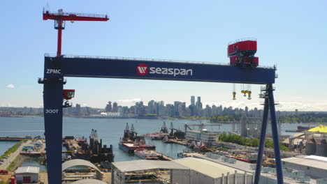 Stunning-aerial-view-of-the-downtown-Vancouver-skyline-through-a-dry-dock-crane