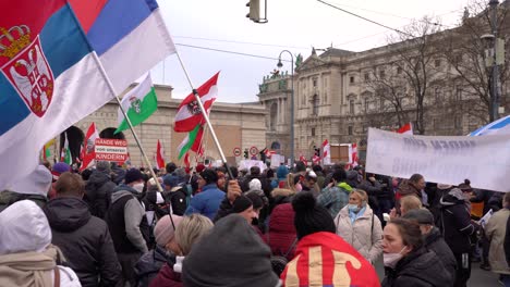 Serbian-flags-waving-at-anti-corona-protests-in-Vienna,-Austria