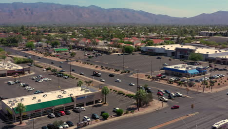 Aerial-View-Of-Broadway-Plaza-Shopping-Mall-At-East-Broadway-Boulevard-In-East-Tucson,-Arizona-Santa-Catalina-Mountains-In-Distant-Background
