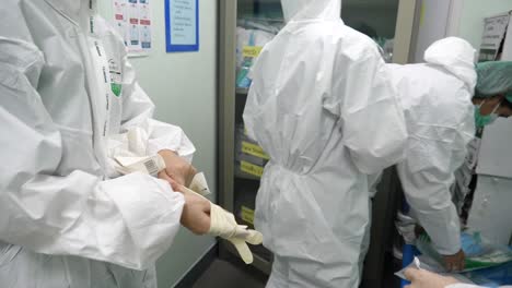 Medic-Staffs-Putting-On-PPE-Suits-Before-Working-Due-To-COVID-19-Epidemic
