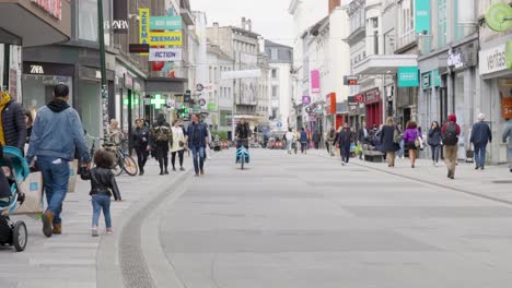 Wide-angle-view-of-people-crowd-in-city-center-shopping-street-in-the-Matongé-quarter-in-Ixelles---Brussels,-Belgium
