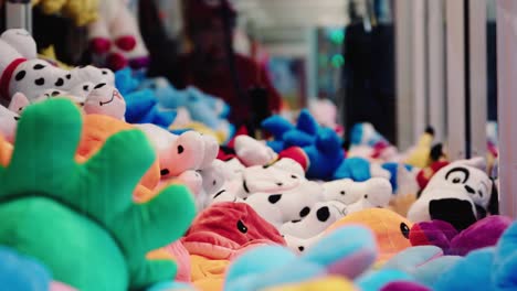 Claw-Machine-with-cute-fluffy-animal-toys-failing-to-get-a-prize