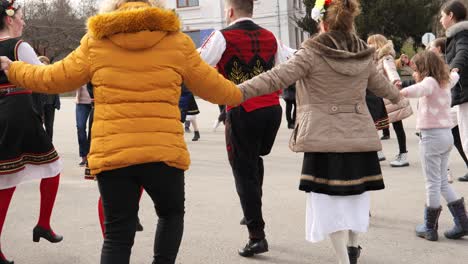 Happy-Bulgarian-crowds-celebrating-dancing-traditional-horo-in-village-square