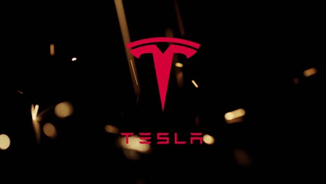 Illustrative-editorial-of-Tesla-icon-appearing-with-glitter-fireworks