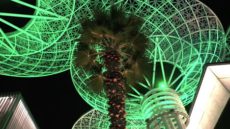 Modern-Futuristic-Artificial-Glowing-Trees,-Dubai-Tourist-Attraction-at-Night,-Low-Angle-View