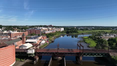An-aerial-view-over-the-Norwalk-River-Railroad-Bridge-on-a-sunny-morning